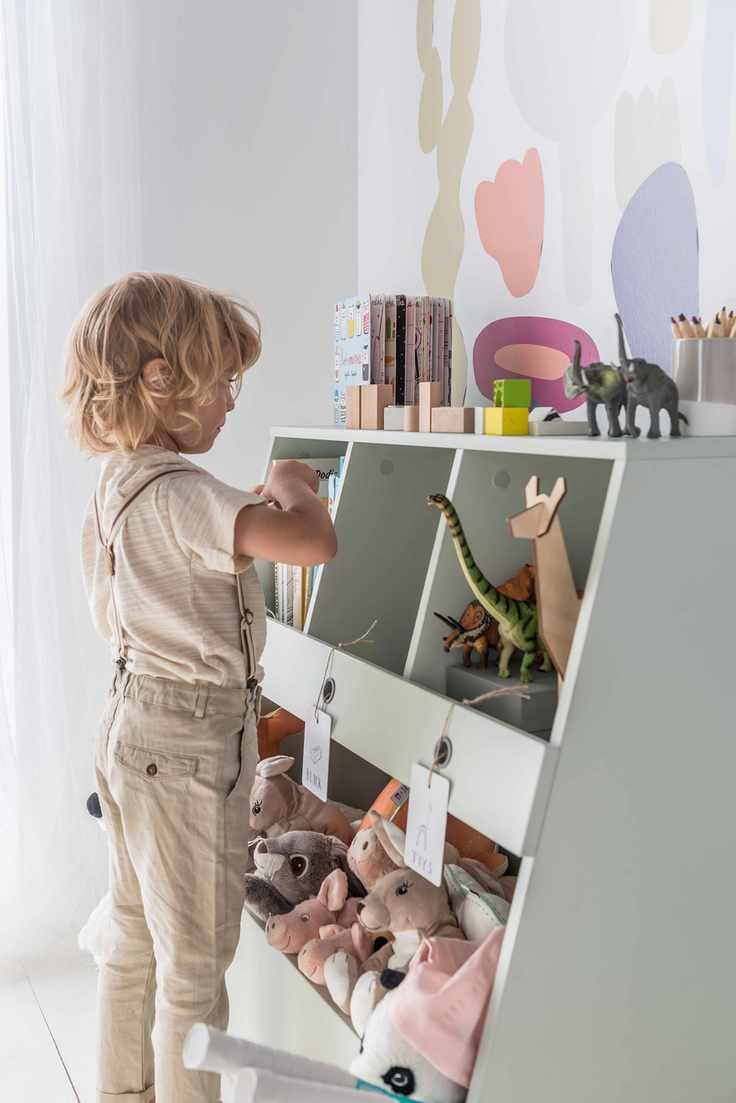 Playroom storage in open shelves with cuddly toys