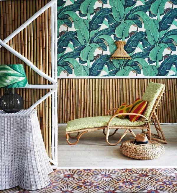 vibrant palm leaf wallpaper with bamboo panelling and lounger
