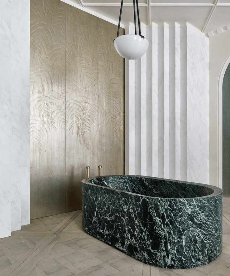 Bathroom featuring a 3D wall design
