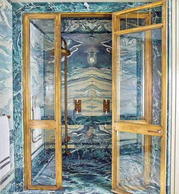 Green marble shower with gold accents