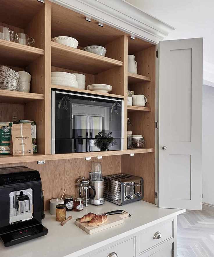 Close up of gray and wooden pantry with bi-fold doors