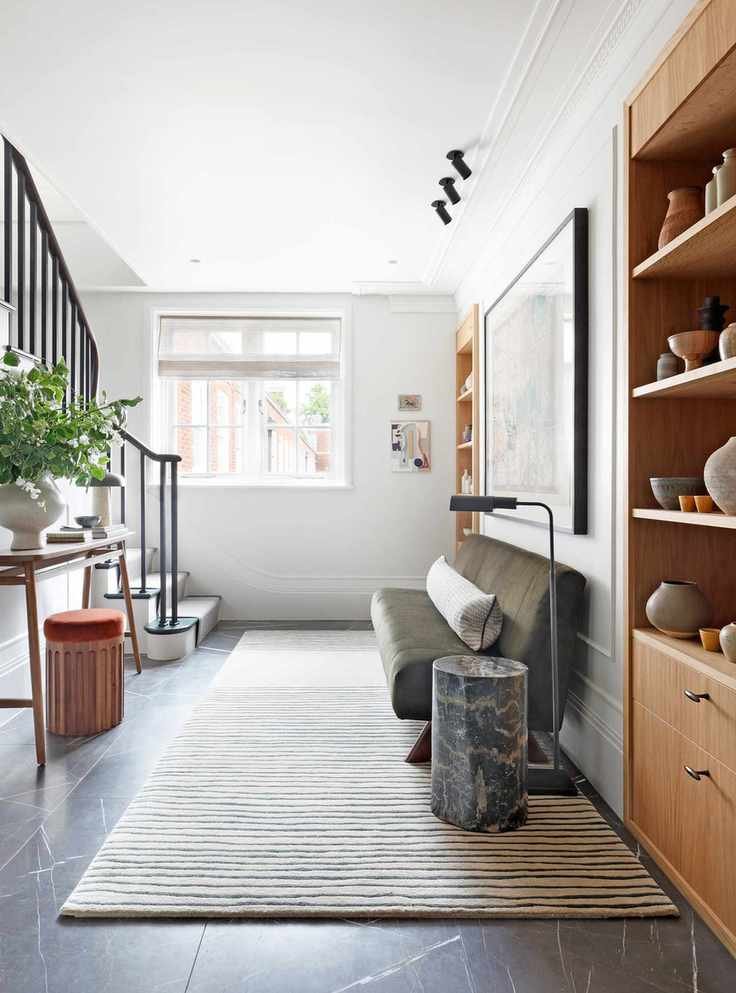 White entryway ideas for apartments with wood furniture and floor