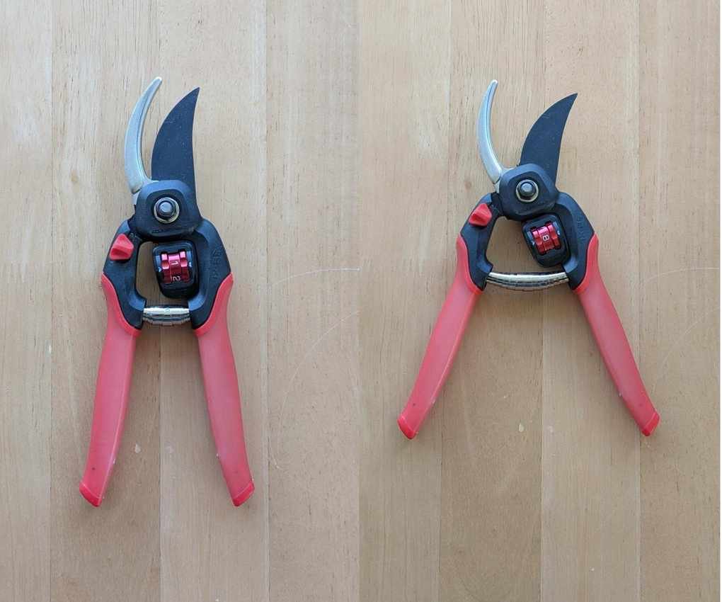 A pair of open Corona FlexDIAL ComfortGEL Bypass Pruner side by side to show the different ranges