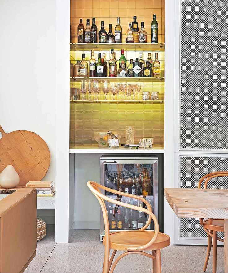 Home bar with tiled backsplash