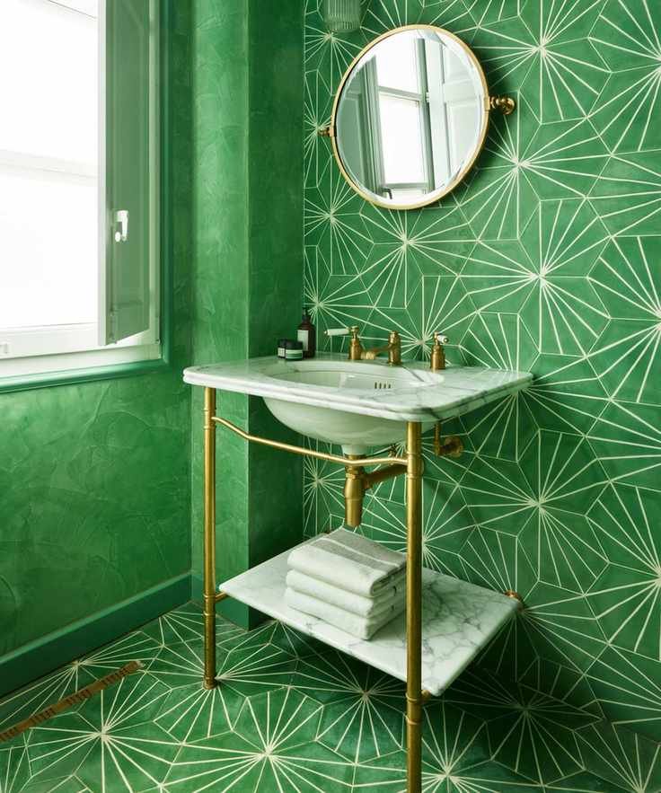 Bright green bathroom with Moroccan-style floor and wall tiles