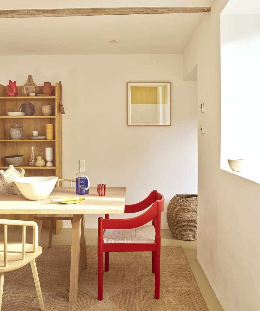 Bright dining room with red chair