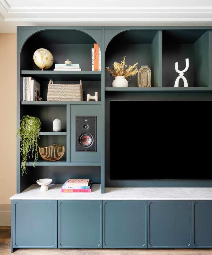blue built-in media wall tv cabinet with decorative accessories
