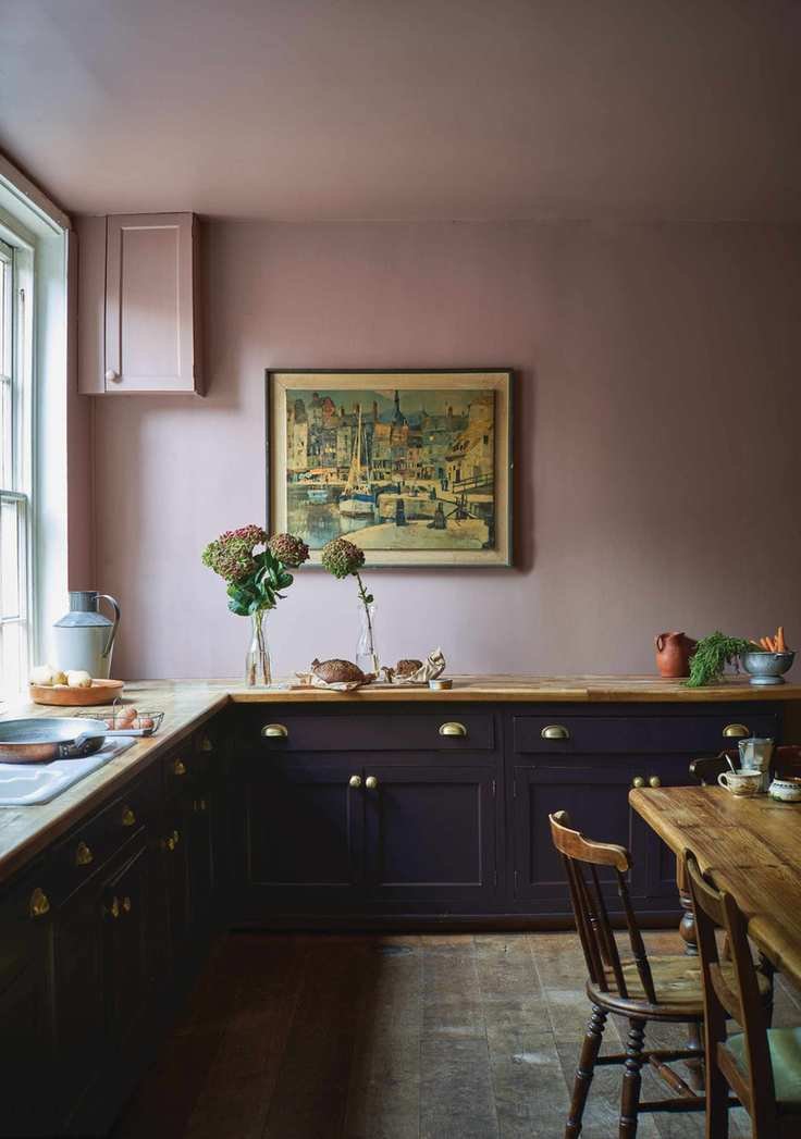 Painting kitchen cabinets with Farrow and Ball midnight blue paint in a pink kitchen.
