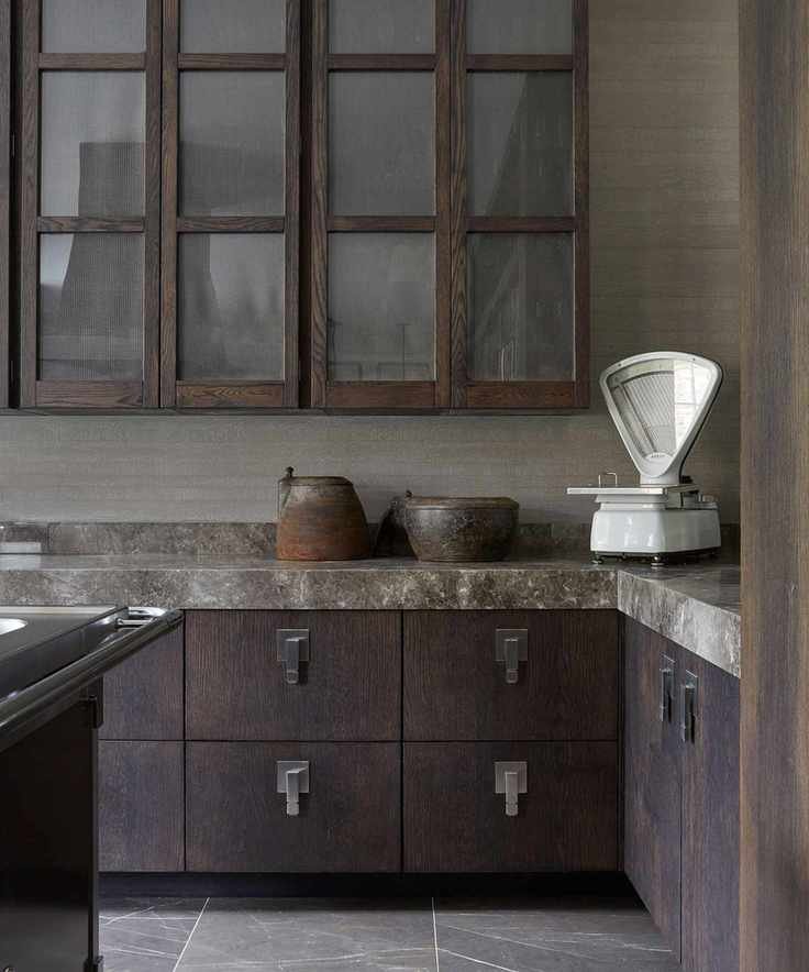 Dark kitchen cabinetry with smoky marble countertop