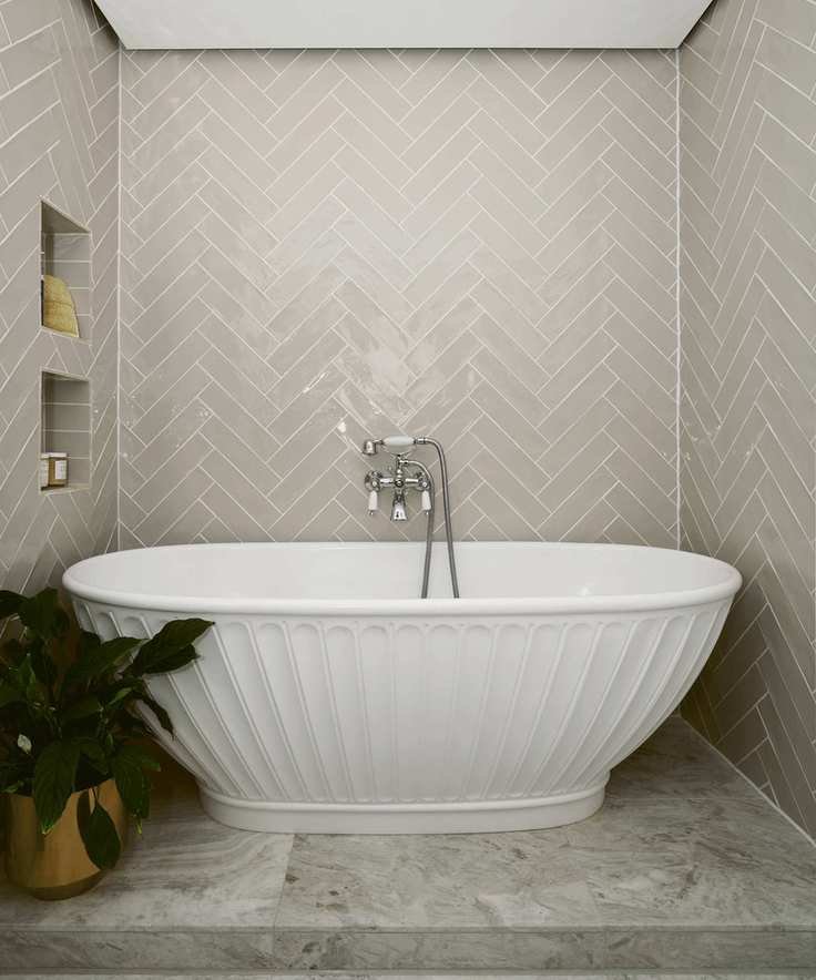 Bathroom with herringbone wall tiles