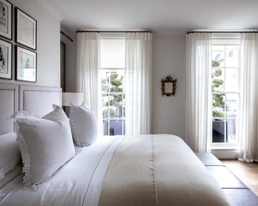 Chic white bedroom with layered textures