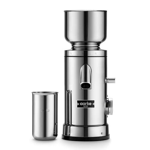 A stainless steel coffee grinder beside a stainless steel catch up