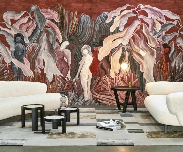 modern living room with a checkerboard rug, two large curved boucle sofas, little black wooden side tables and a large red painted abstract wall mural