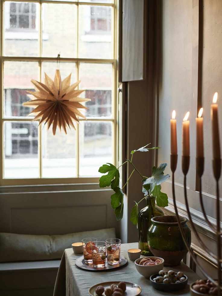 cocktails on a sideboard with candles