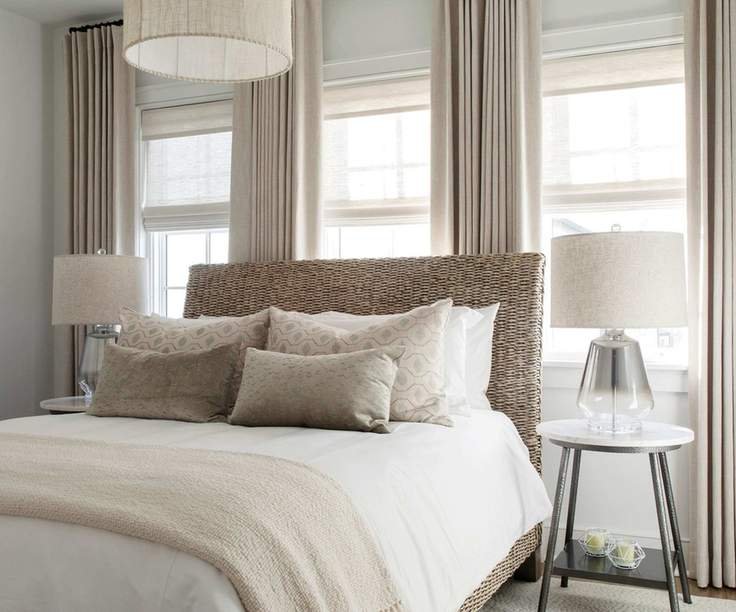 Wicker bed with cream curtains