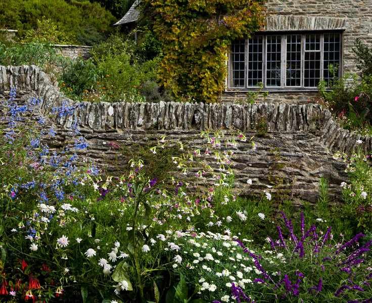 profusely flowering borders of arts and crafts garden coleton fishacre National Trust
