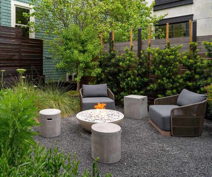 gravel patio seating area with fire pit