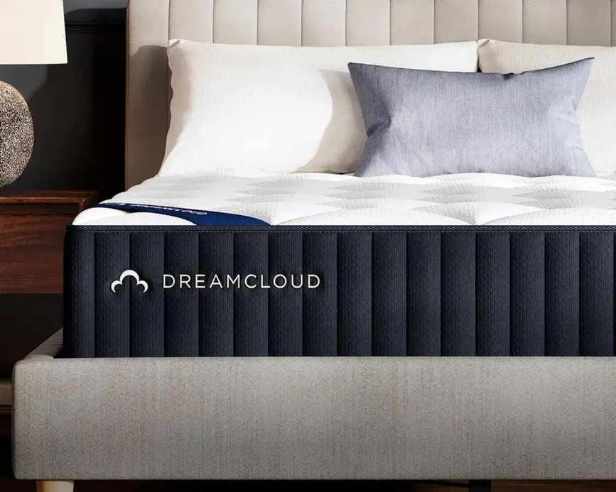 DreamCloud Hybrid Mattress on a grey bedframe.