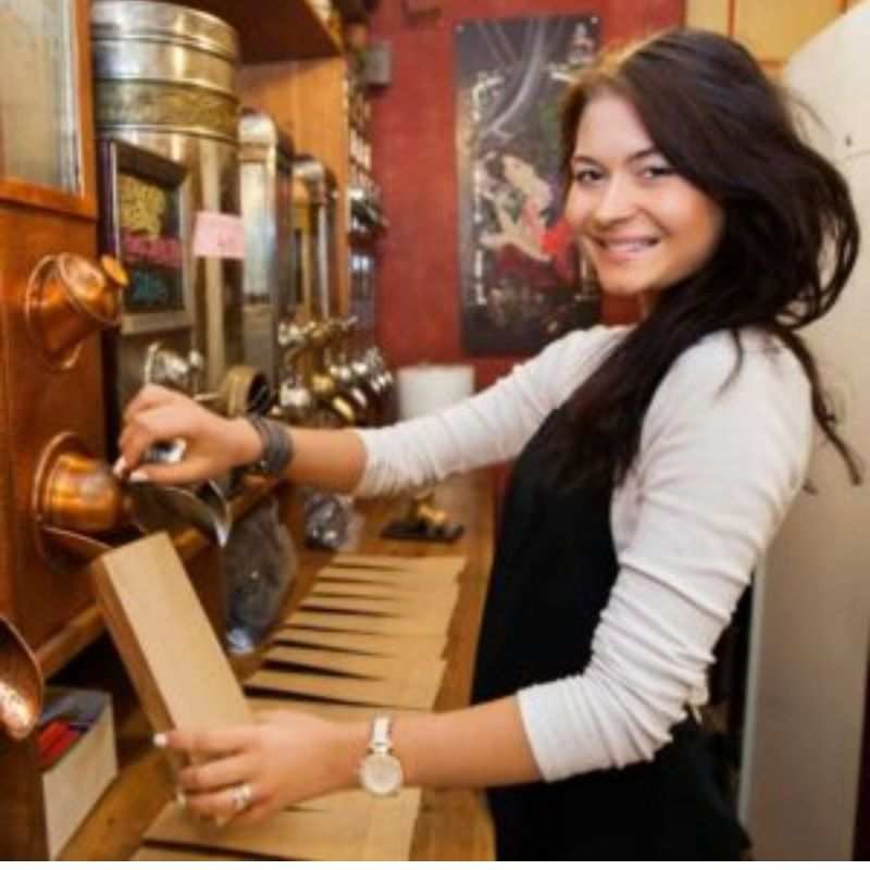 kathryn Henris by a coffee machine