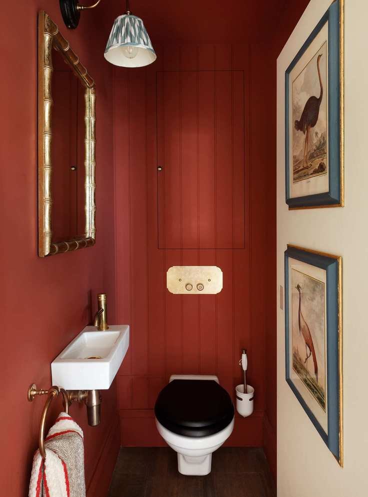 Dark red cloakroom with paneled walls