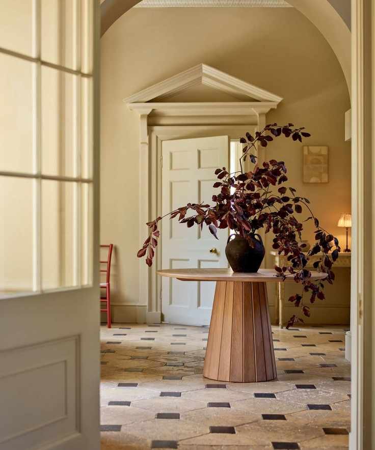 neptune tiled grand entryway foyer with round table