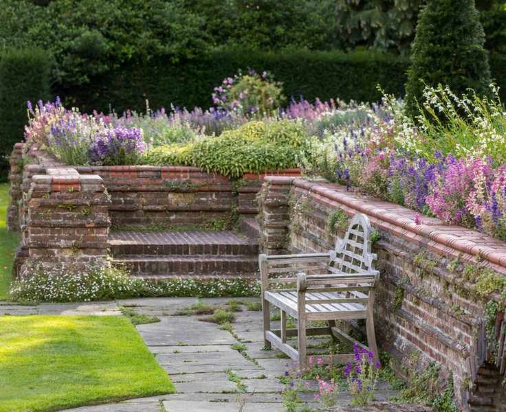 lutyens bench in arts and crafts gardens of Goddards National Trust
