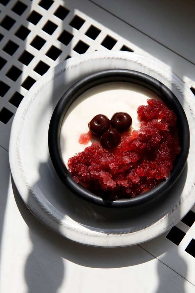 Lively Vanilla Panna Cotta with Pomegranate Granita and Cherries
