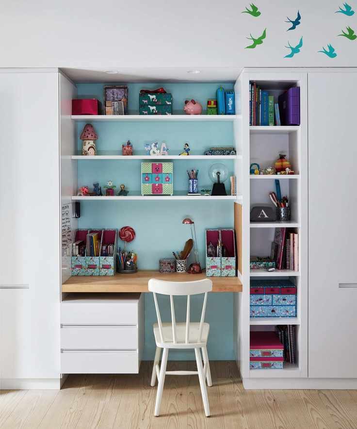 A child's bedroom with a recessed desk area
