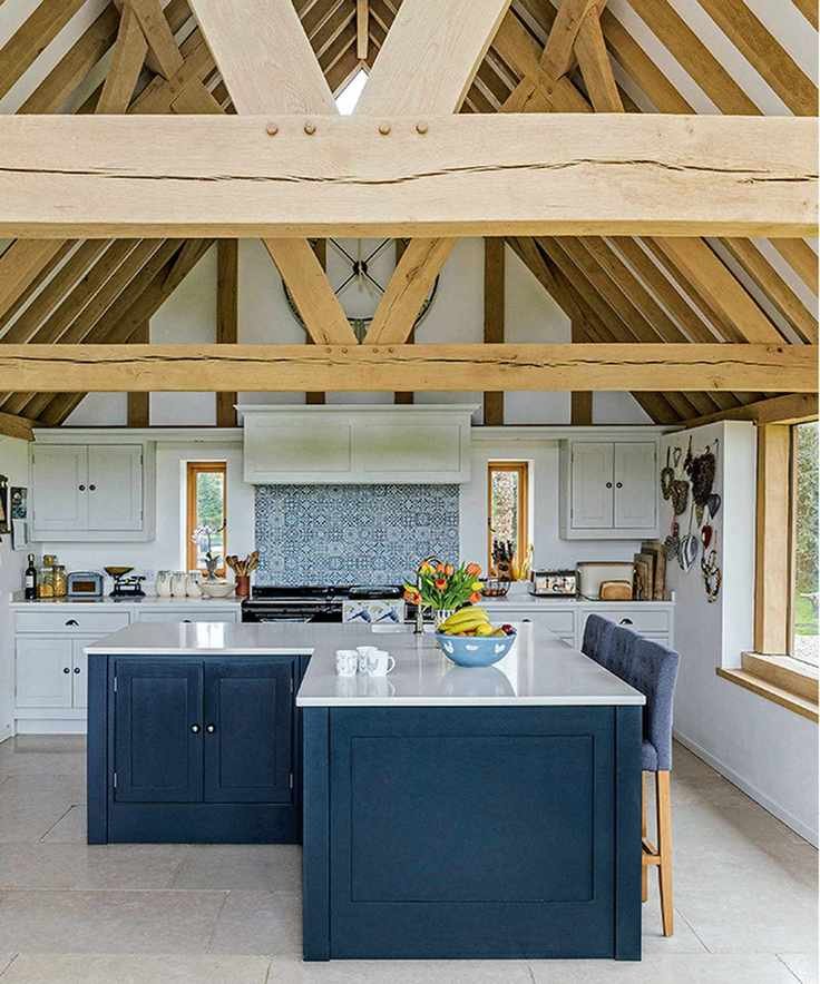 wood frame extension with blue kitchen