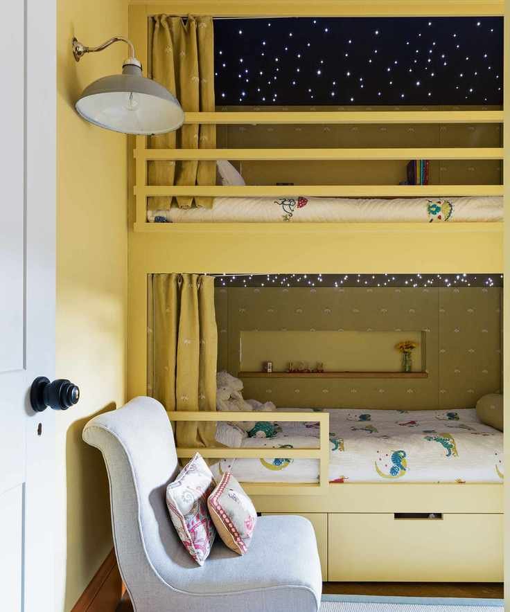 Yellow bunk bed with fairy lights