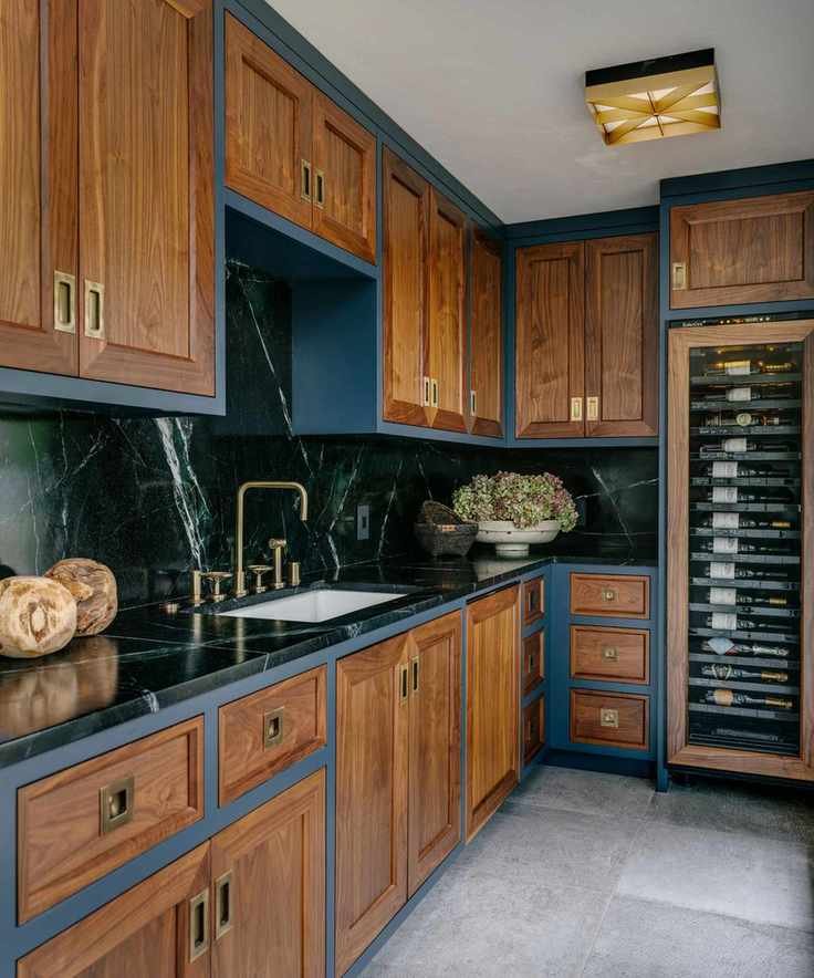 Wooden kitchen with navy blue painted accents