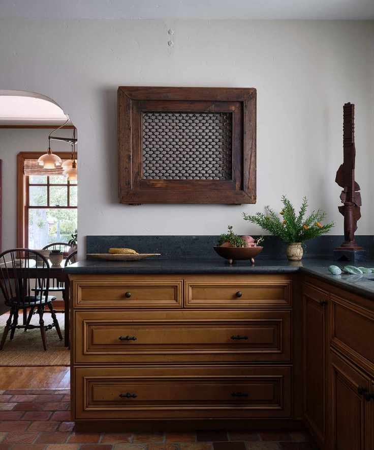 Vintage wooden kitchen with white walls and rustic decor