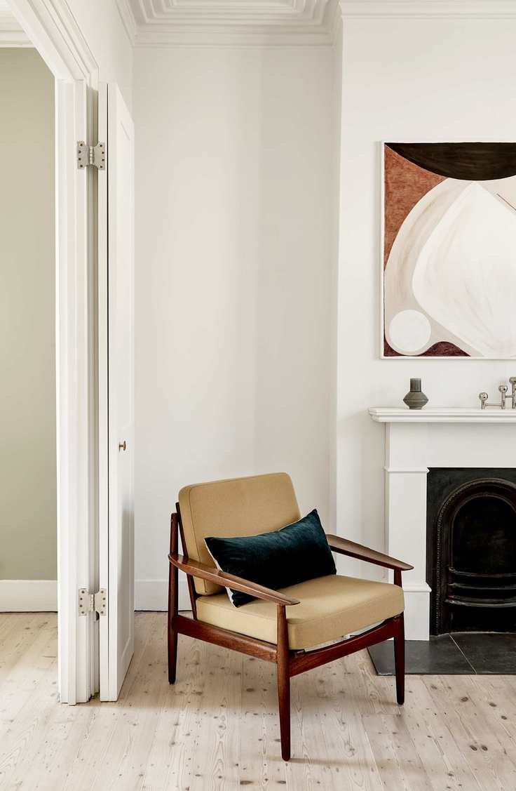 White living room with a midcentury armchair