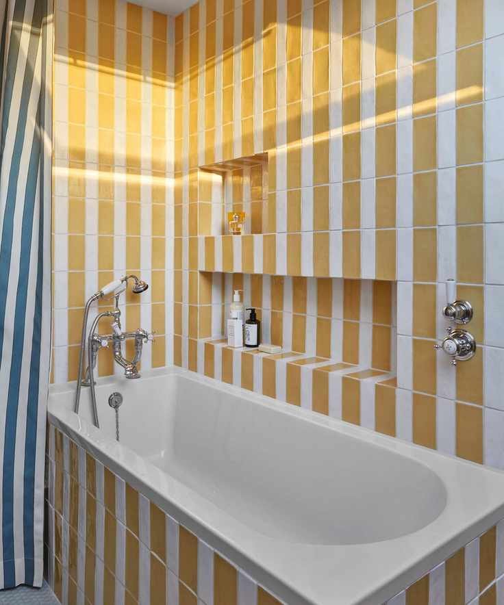 bathroom with yellow and white stripe tiles
