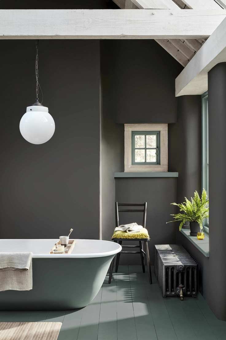 Gray painted bathroom with a small window