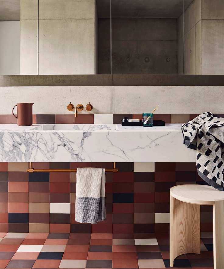 Bathroom with wall tiles matching the floor design