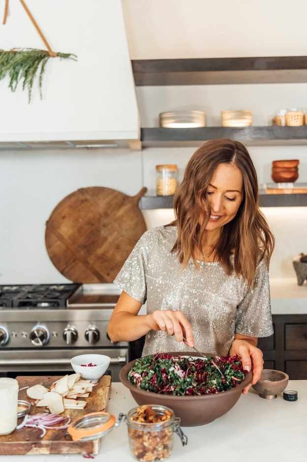 camille making salad in kitchen, meal prep, winter ingredients