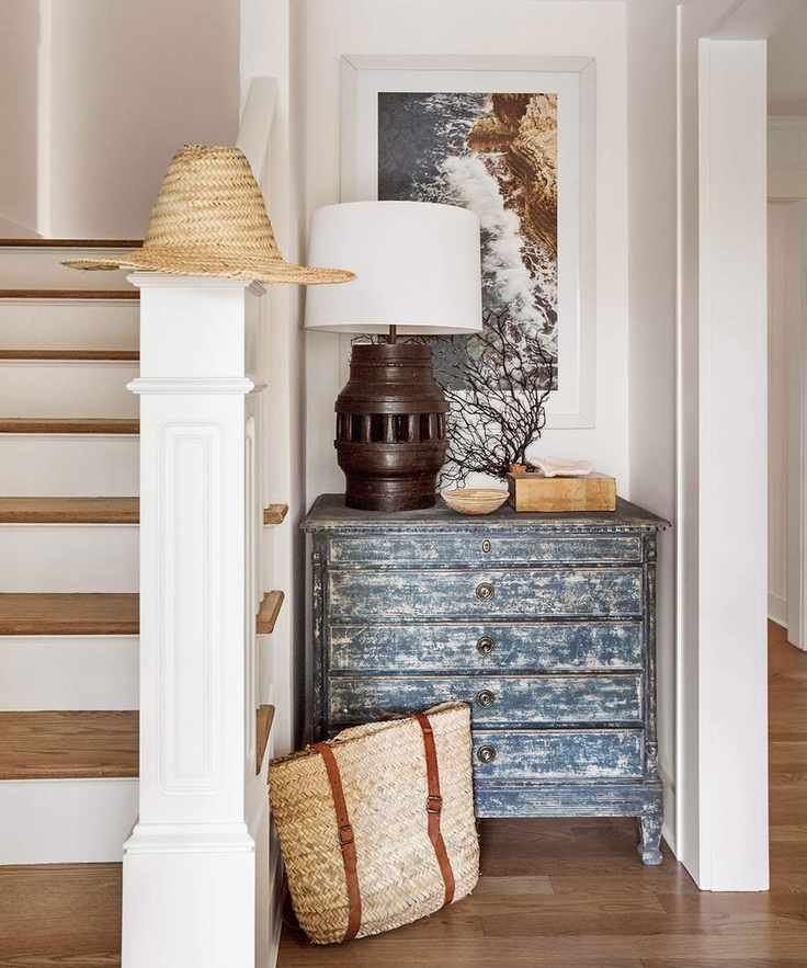 White entryway with wood features