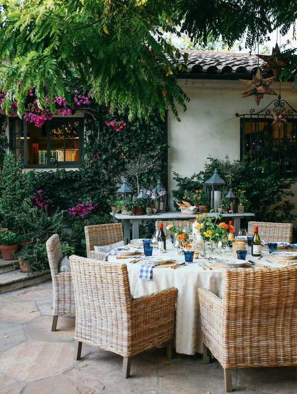 Wicker chairs around an outdoor dining table