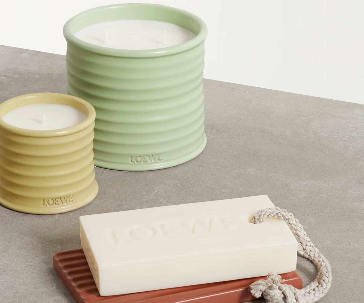 Loewe candles and a soap on a countertop