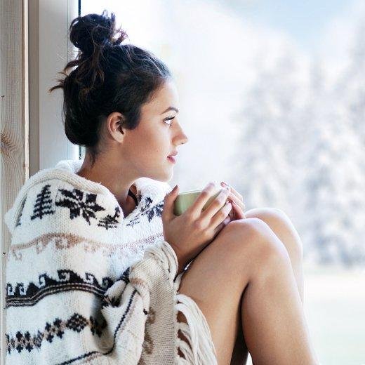 Girl looking out through the window