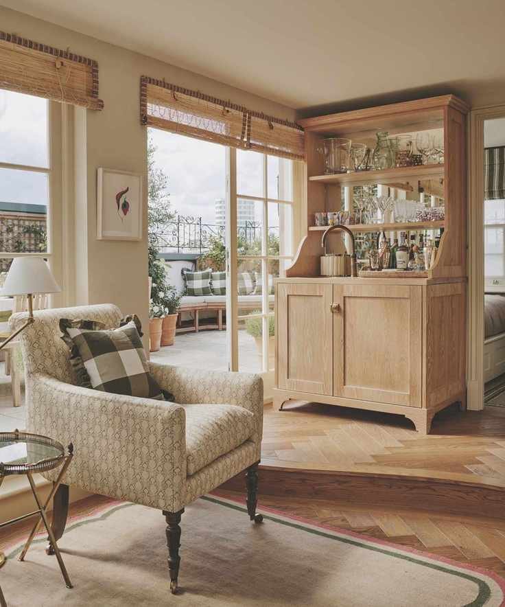 freestanding wooden home bar in corner of house full of natural materials and neutral colour