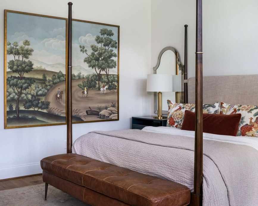 neutral bedroom with wooden four poster bed, beige bedding and vintage accents