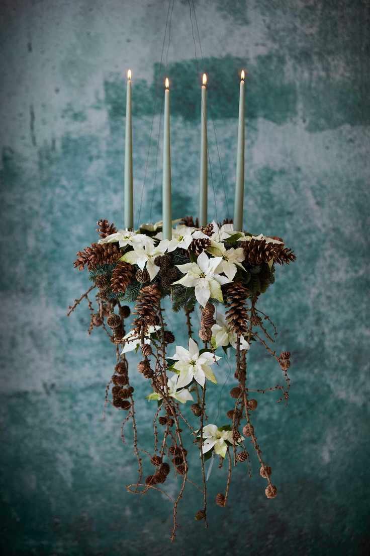 Pine cone and poinsettia candelabra