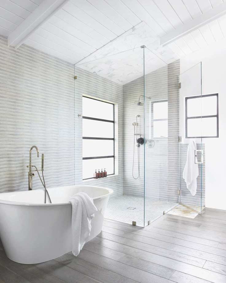 walk in shower with white tub