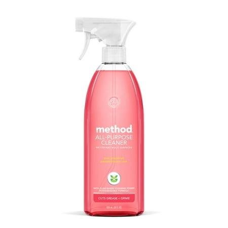 A clear plastic spray bottle with a white nozzel, pink liquid inside.