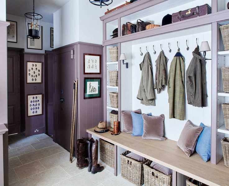 Designing a mudroom to incorporate stylish dusky purple paneling and velvet cushions