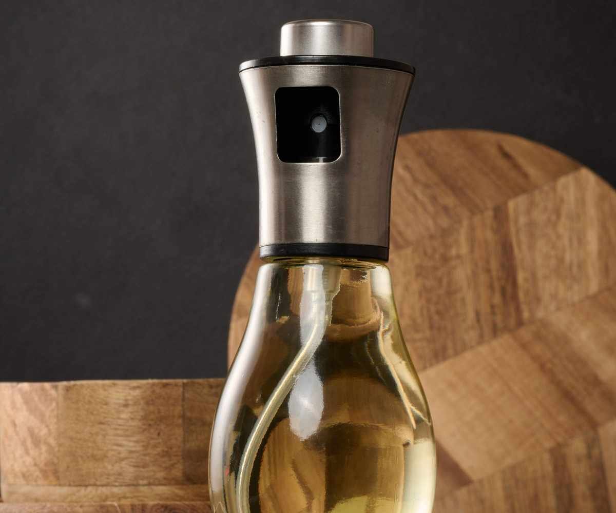 A glass olive oil spray bottle