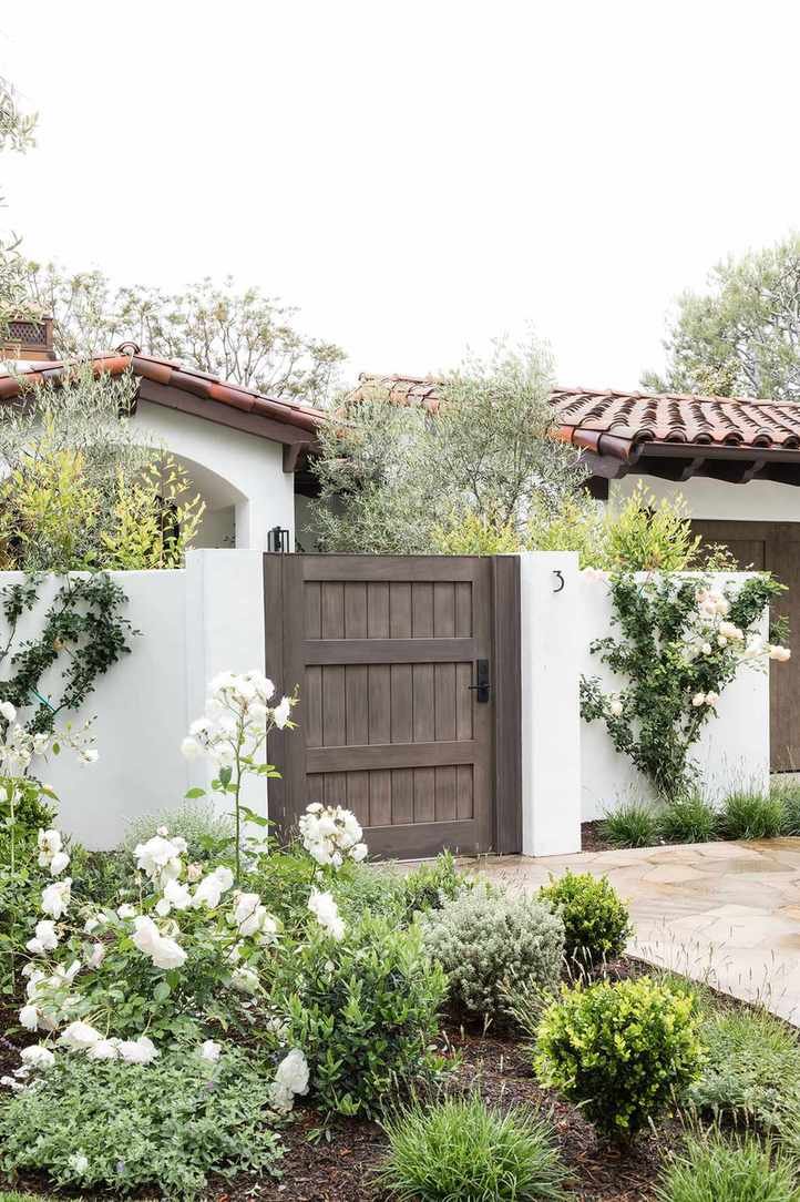 spanish style house with rendered front wall