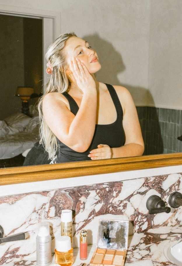 woman applying skincare
